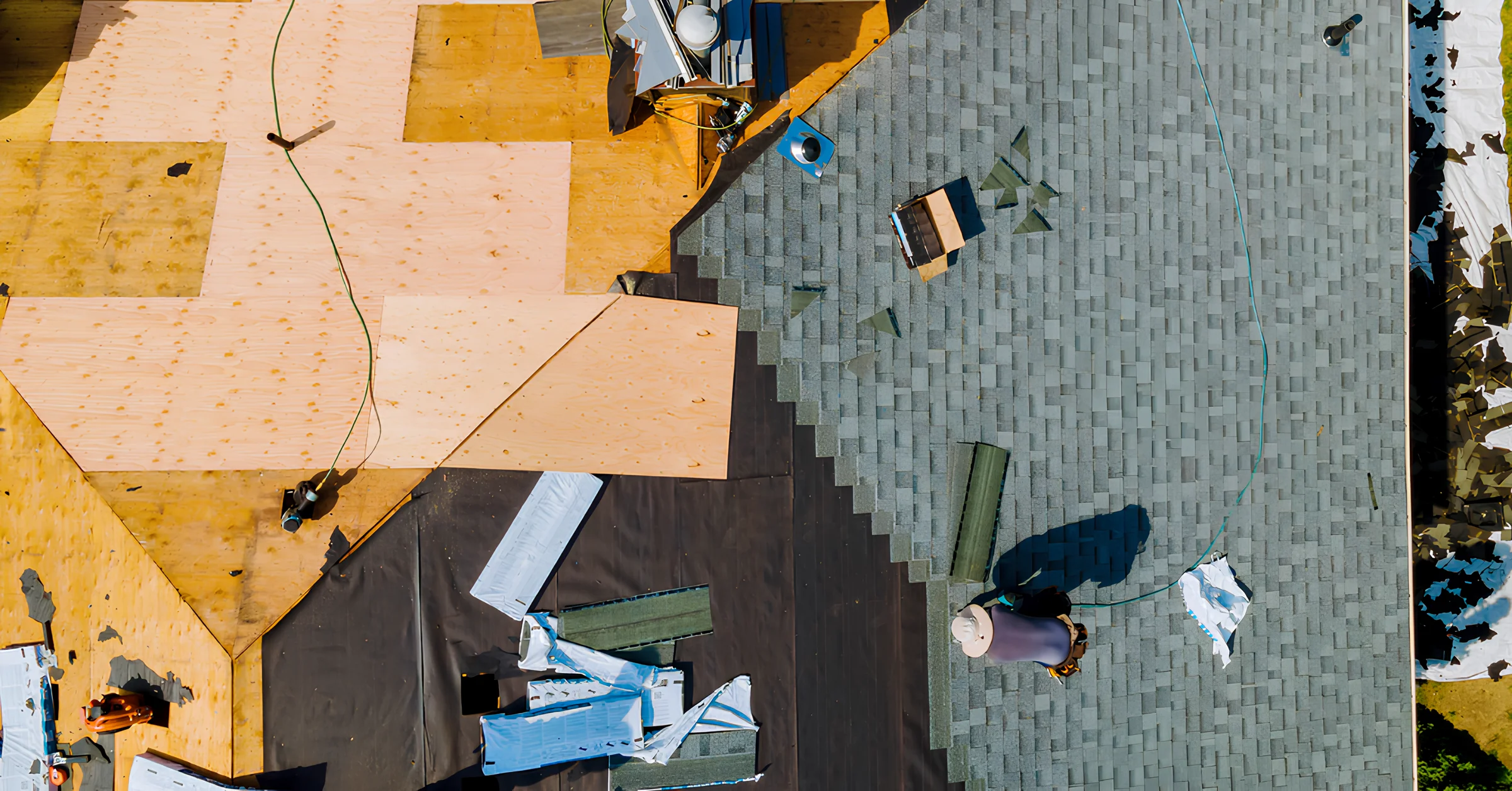 Image of a damaged roof going through an assessment how much do roof replacements cost.